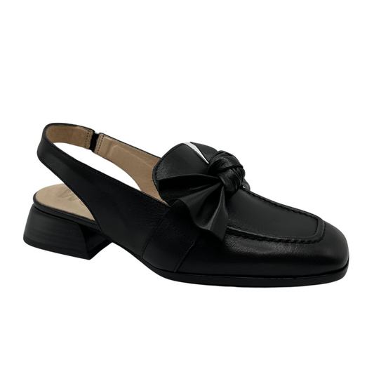 45 degree angled view of black leather slingback loafer with knotted bow detail and square toe