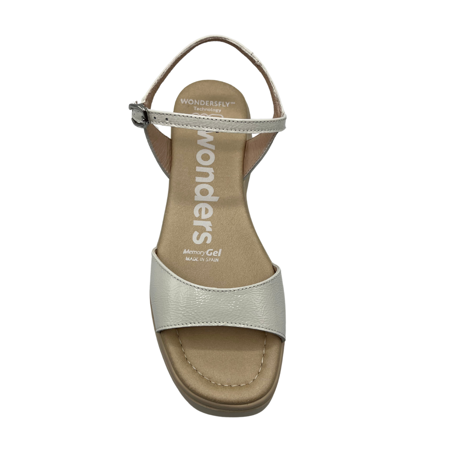 Top view of a white and nude leather sandal with a platform sole, adjustable ankle strap with a silver buckle.