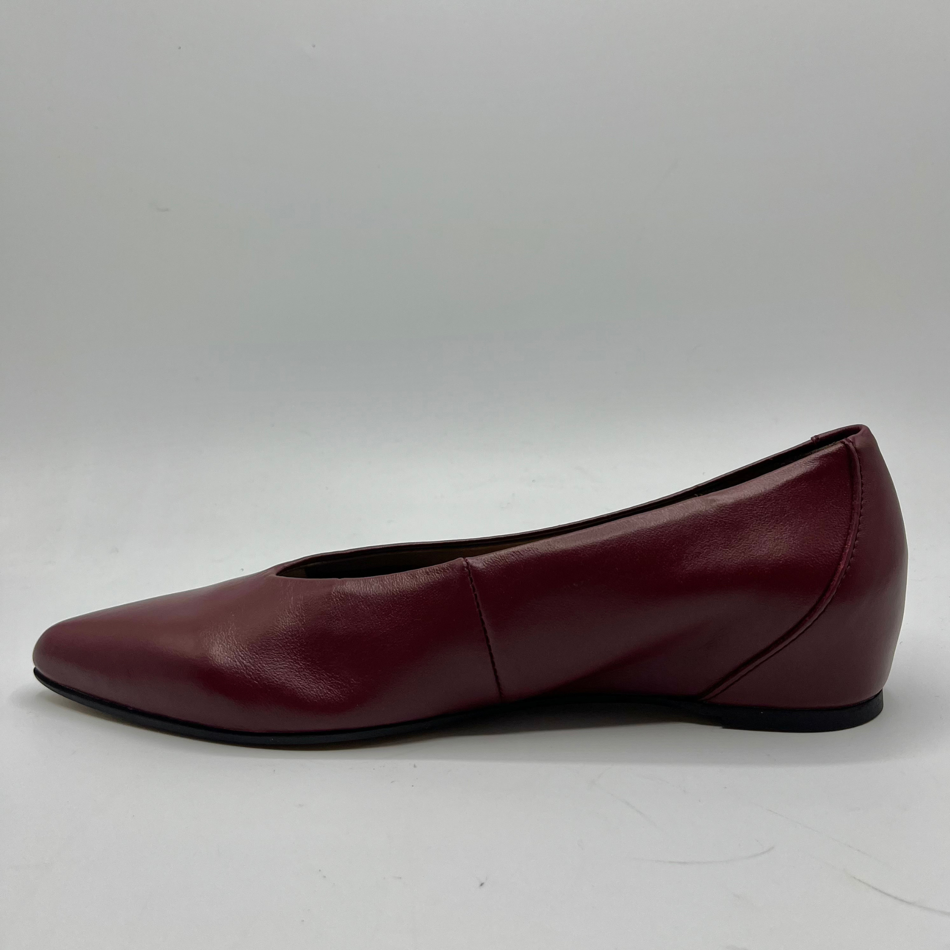 Maroon leather shoe on a white background
