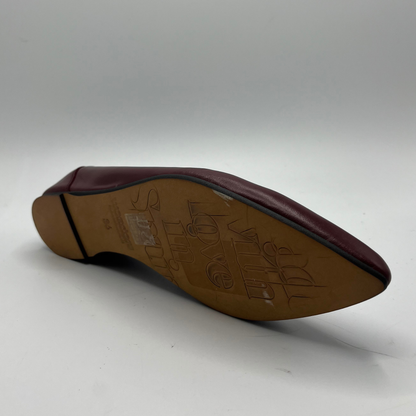 Brown shoe sole with brand logo on a white background