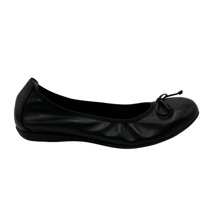 Right facing view of black leather ballet flat with bow detail and subtle heel