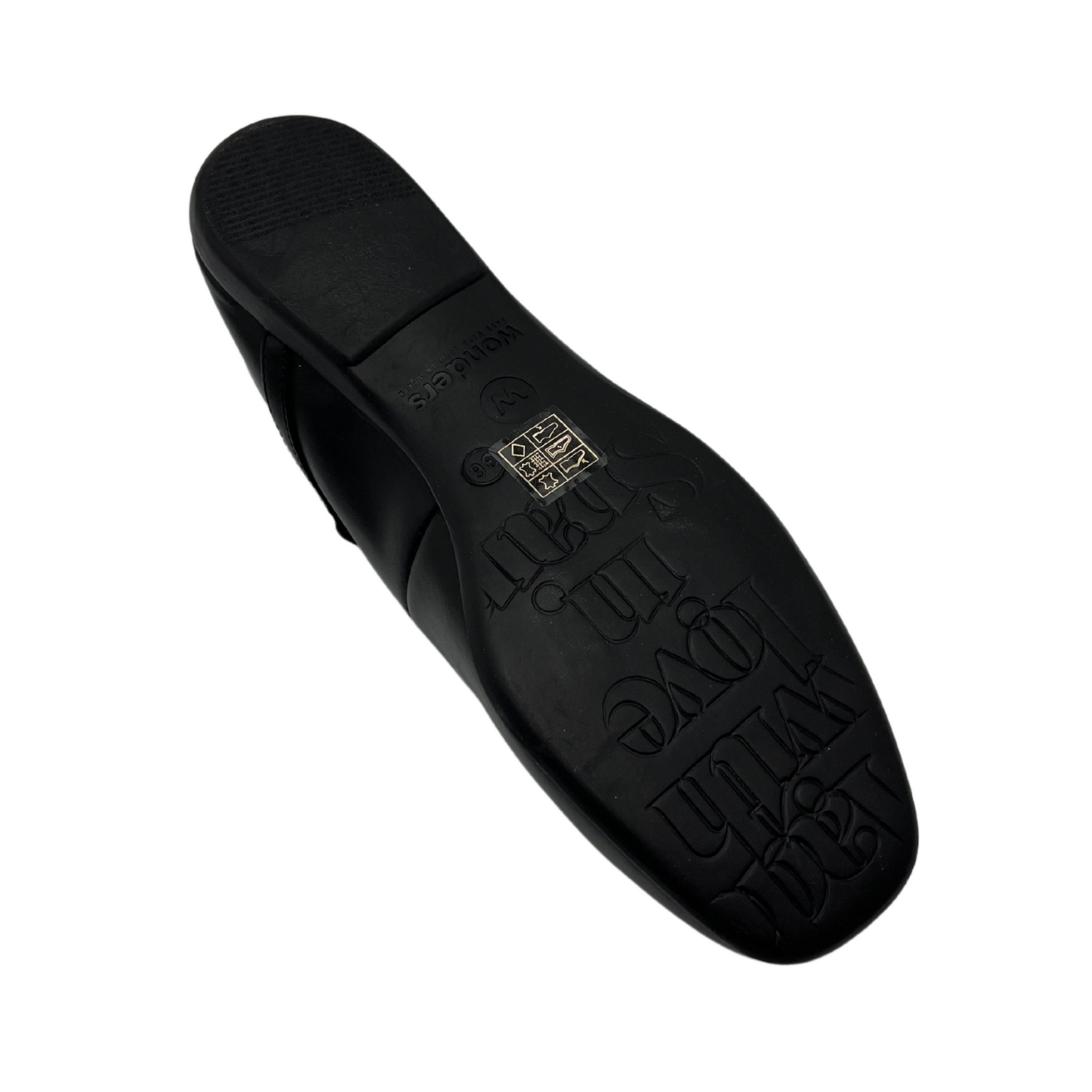 Bottom view of black ballet flat with rounded square toe and tiny strap with silver buckle