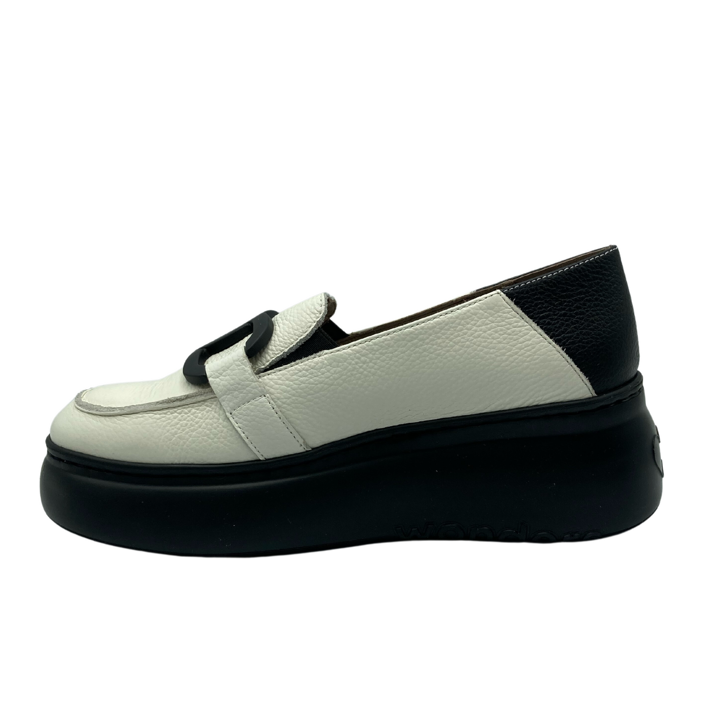 Left facing view of platform loafer with white leather and black rubber sole