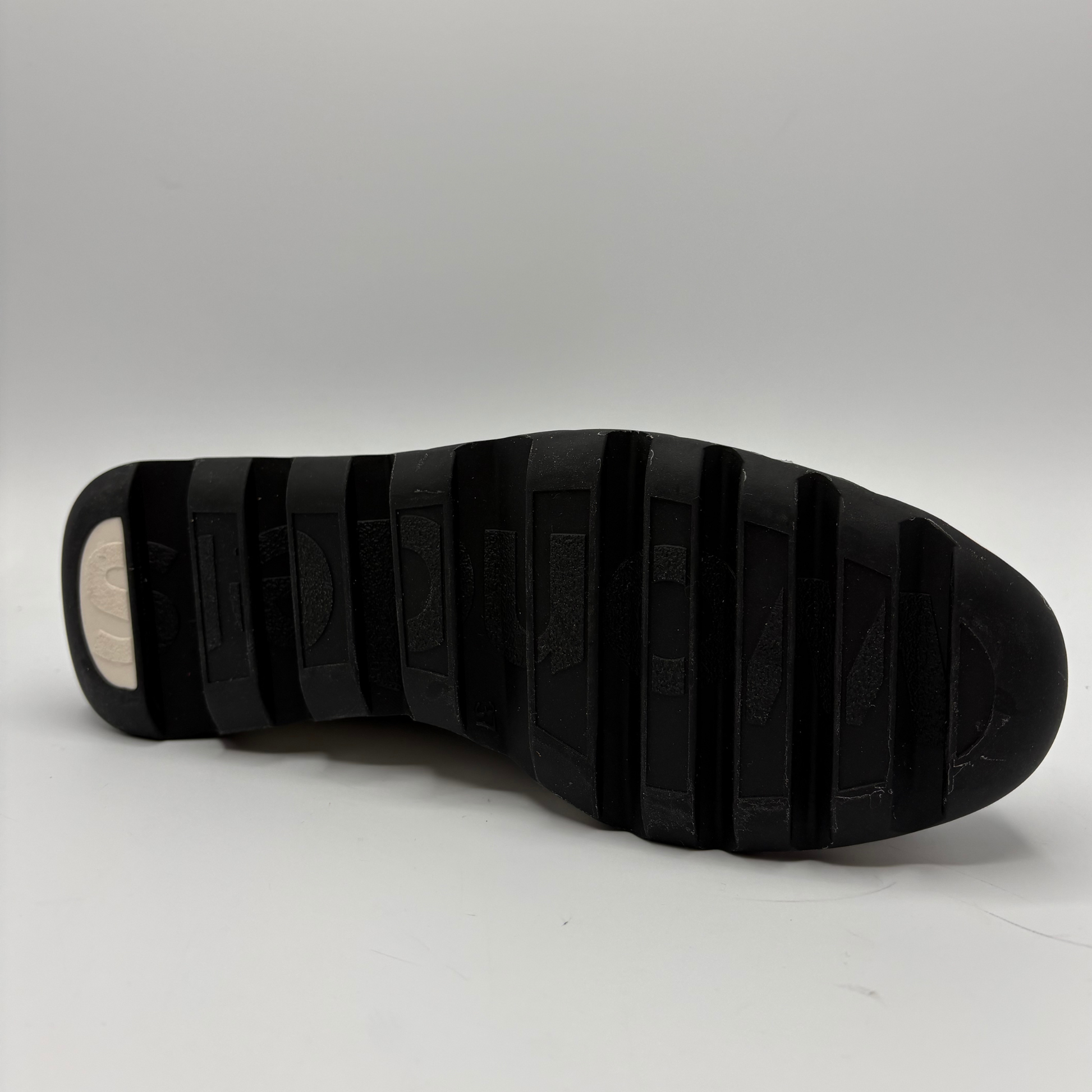 Black sole of a shoe on a white background