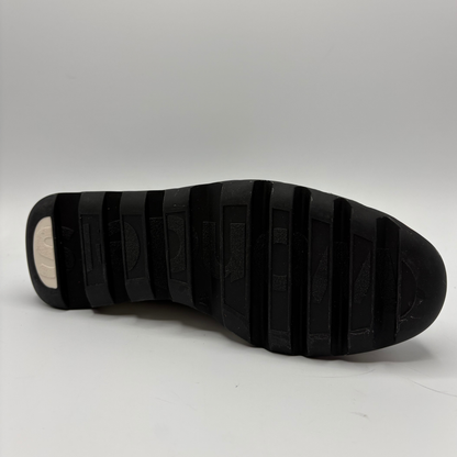 Black sole of a shoe on a white background
