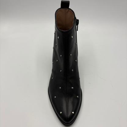 A black leather pointed-toe ankle boot with silver metal studs, shown from a top-down perspective on a light gray background.