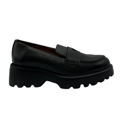 Right facing view of black textured leather penny loafer with chunky track sole