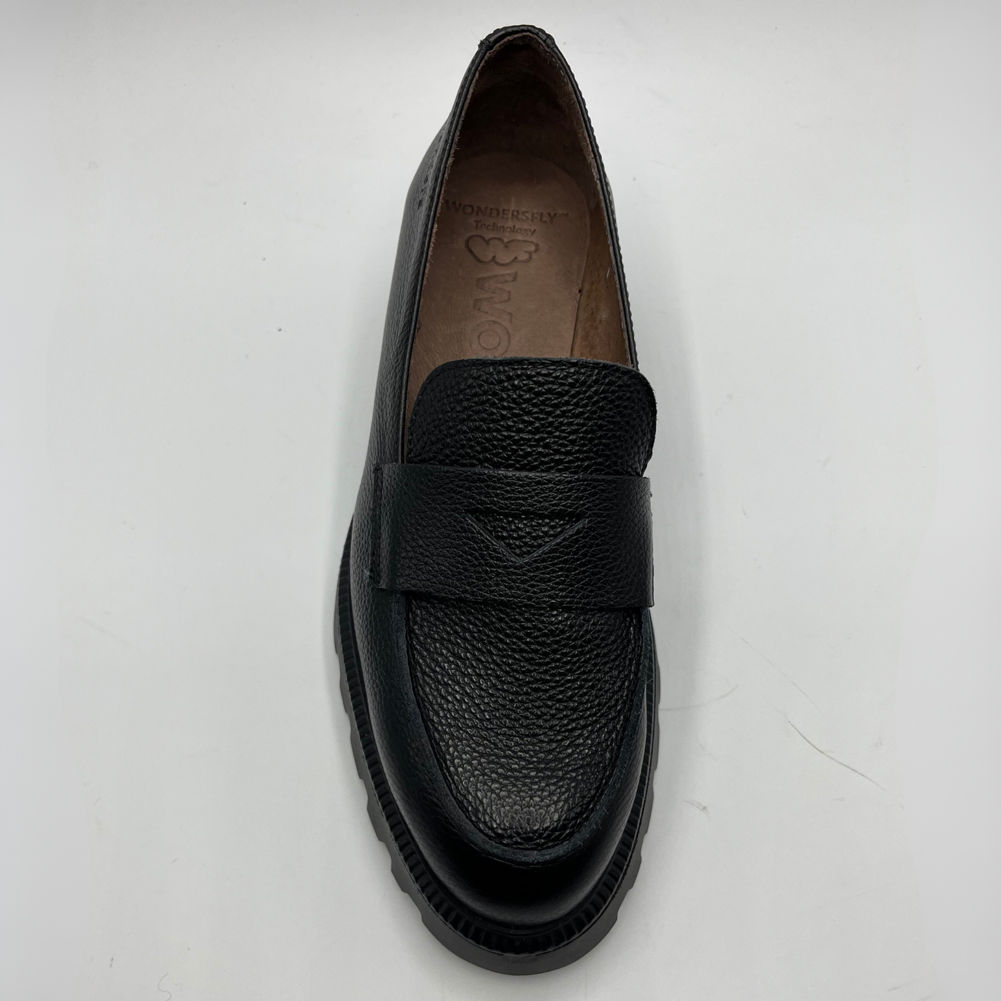 Black loafer shoe on a white background