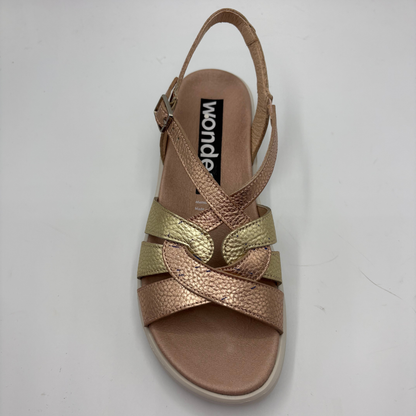 Gold and bronze sandal with 'wonder' brand name on a white background