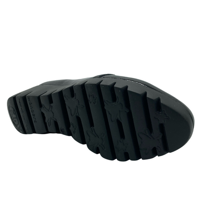 View of the bottom of the black platform shoe sole
