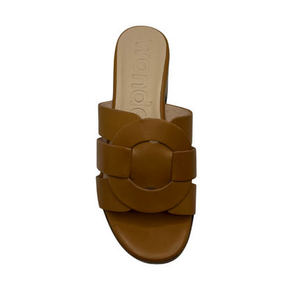 Top view of tan leather strapped slide on sandal with a chunky block heel and platform toe.