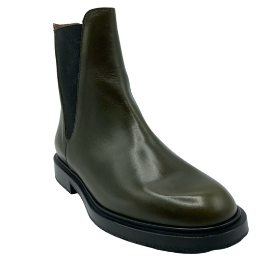 45 degree angled view of olive leather boot with black outsole and elastic side gore