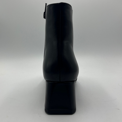 Black ankle boot on a white background
