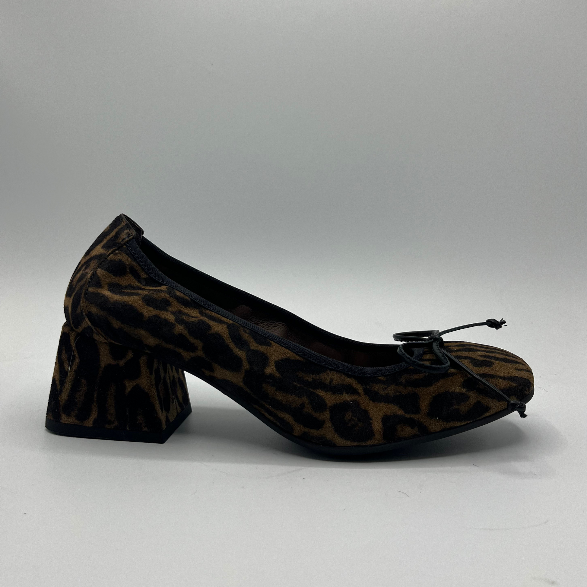 Leopard print high heel shoe on a gray background