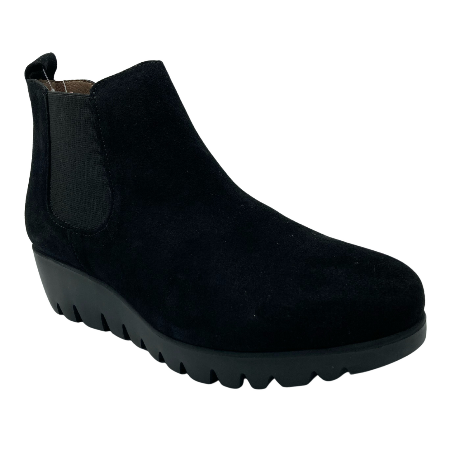 45 degree angled view of black suede ankle boot with elastic side gore and rubber wedge heel