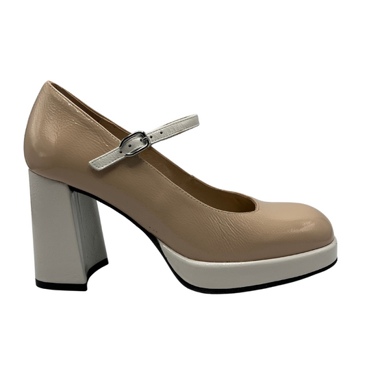 Right facing view of nude leather high heeled mary jane. White leather wrapped heel and strap with a unique shaped high heel.