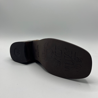 Brown shoe sole with brand logo on a gray background