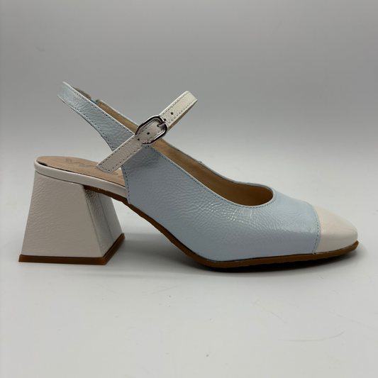 Light blue and off white shoe with a unique heel design on a gray background