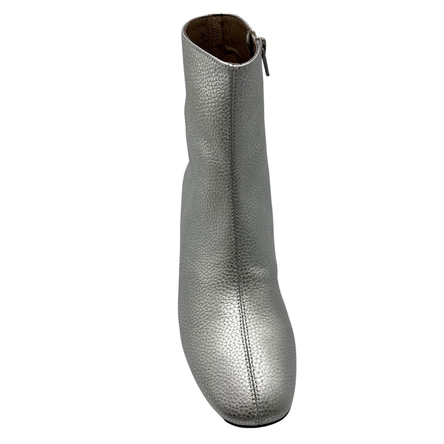 Top view of silver textured leather short boot. Short block, side zipper closure and rounded toe