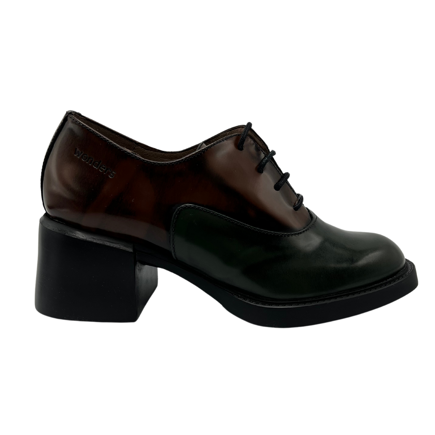 Right facing view of brown and green leather heels. Black outsole with a sturdy block heel