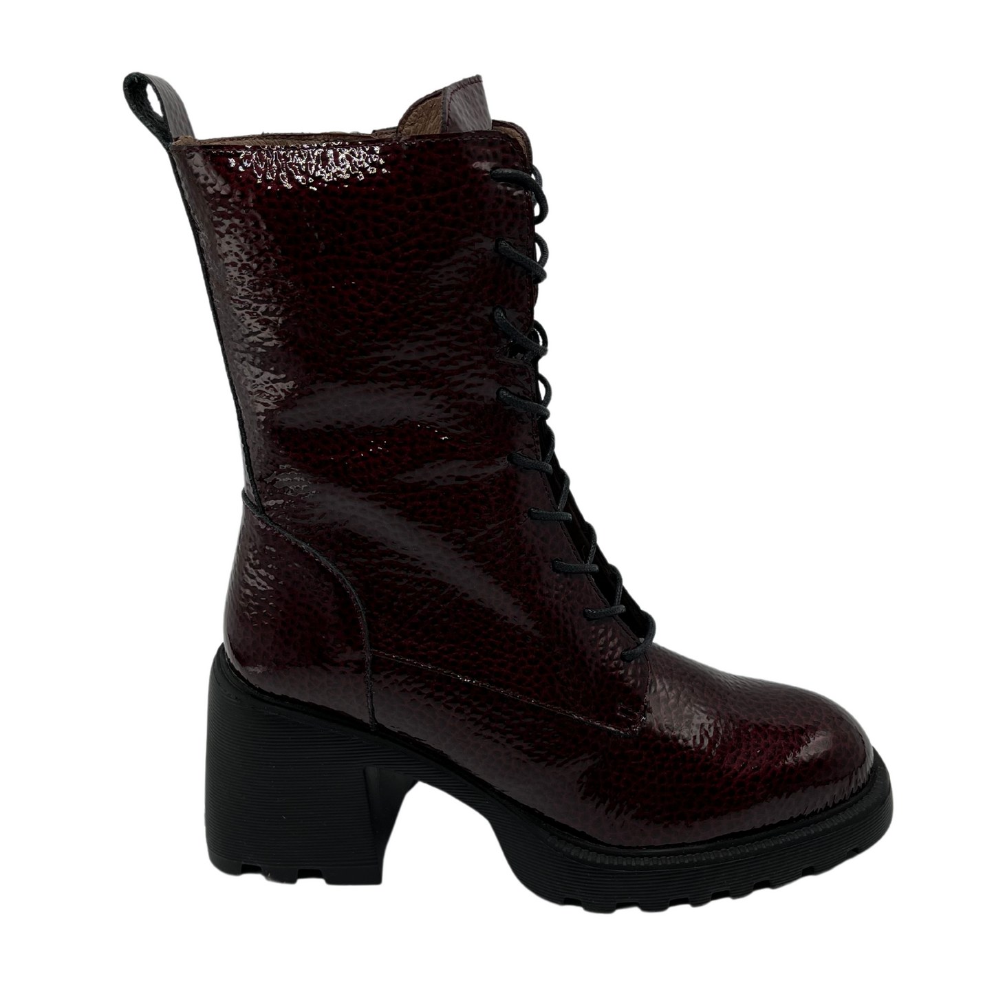 Right facing view of dark wine coloured patent leather boot. Black lace up closure, chunky black outsole and heel.