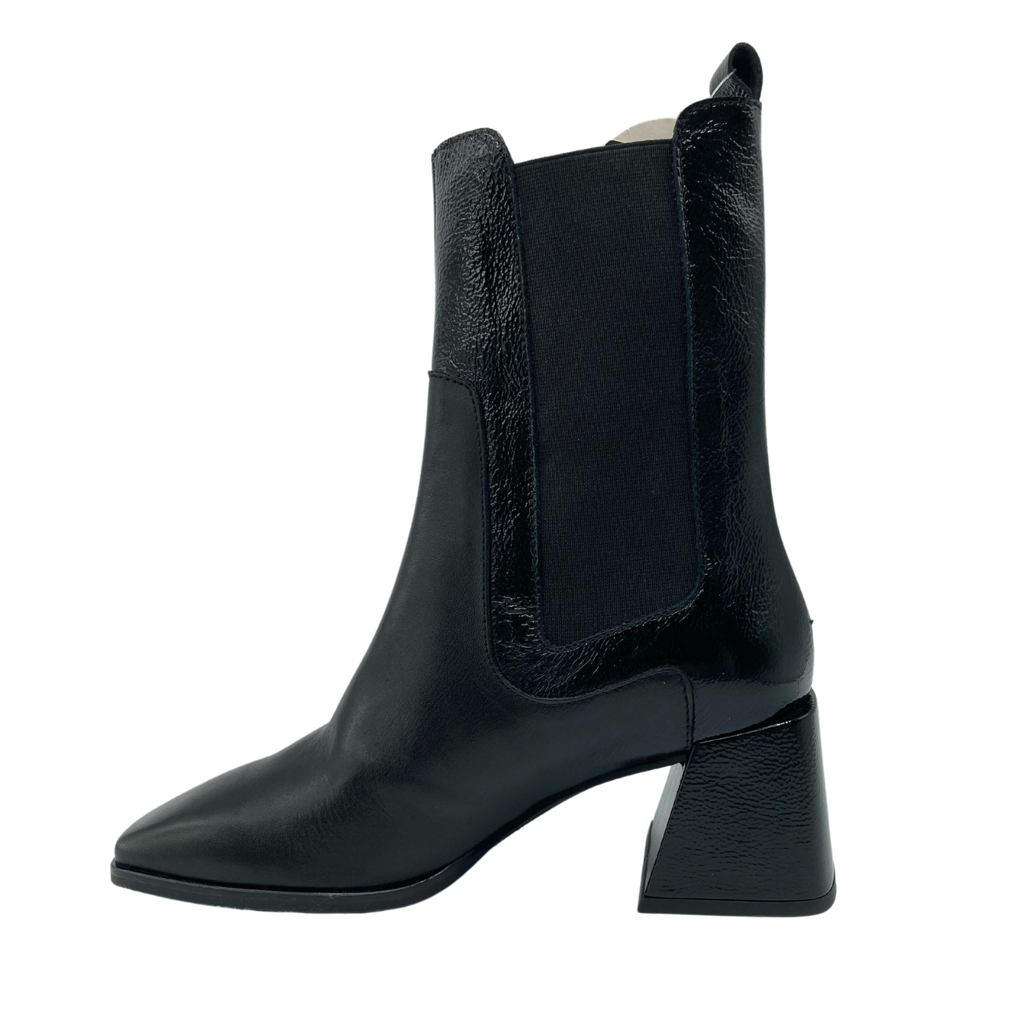 Left facing view of black leather short boot with leather wrapped flared heel and elastic side gores