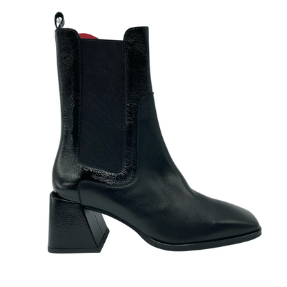 Right facing view of black leather short boot with elastic side gores and flared heel