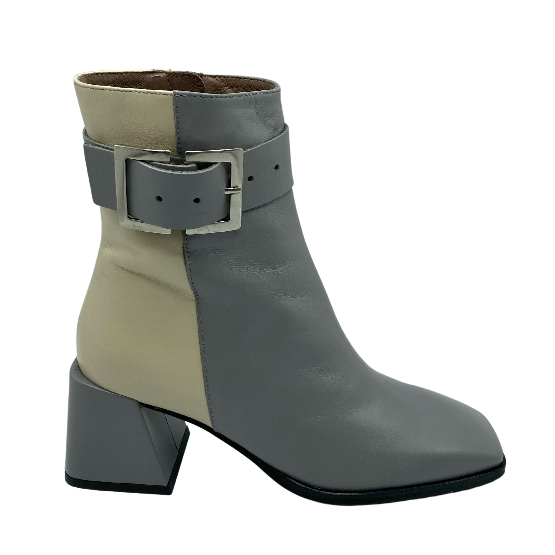Profile view of chunky heeled, two toned boot