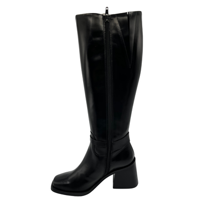 Left facing view of tall, black leather boot. Block heel, rounded toe and side zipper closure