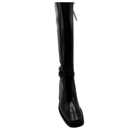 Top view of tall, black leather boot. Block heel, rounded toe and side zipper closure