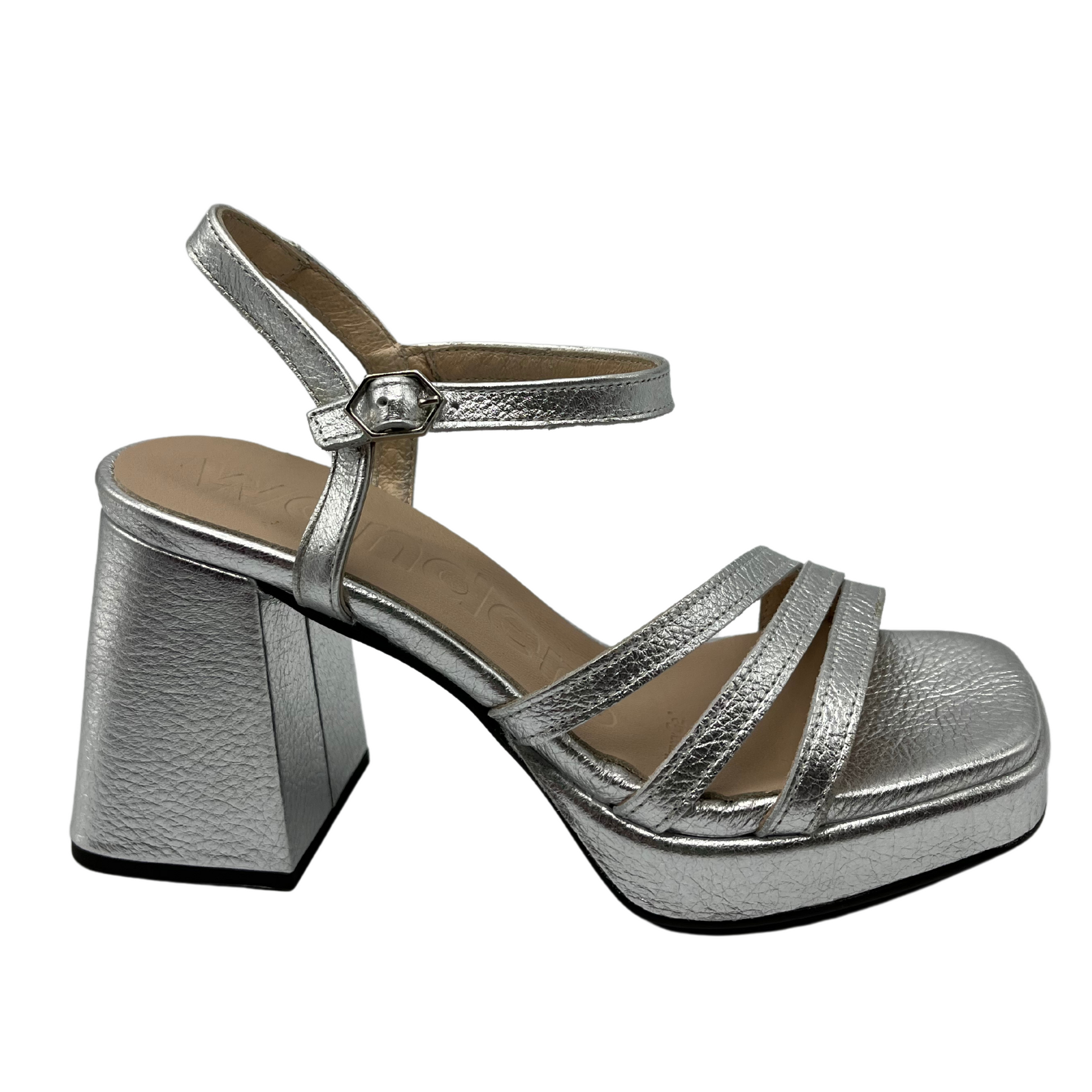 Right facing view of metallic silver sandal with chunky flared heel, thin strap and square toe