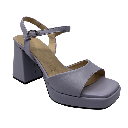 45 degree angled view of leather lavender sandals with chunky flared heel, thin ankle strap and square toe