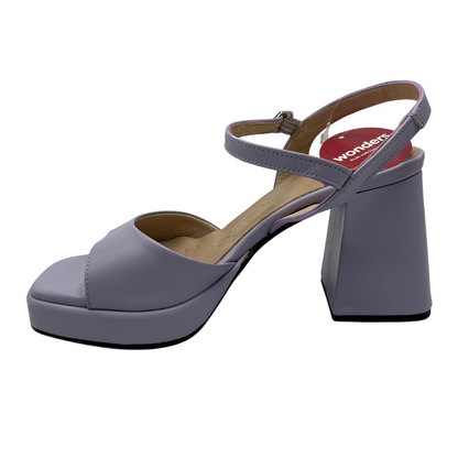 Left facing view of leather lavender coloured sandals with chunky flared heel, thin ankle strap and square toe