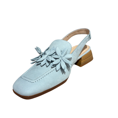 Light blue suede shoe with wooden sole on a white background