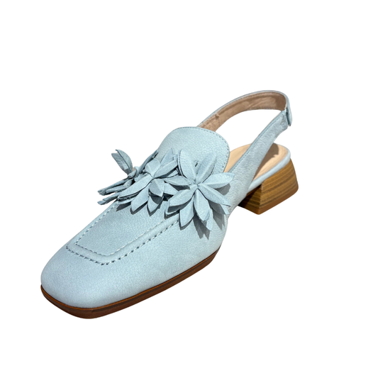 Light blue suede shoe with wooden sole on a white background
