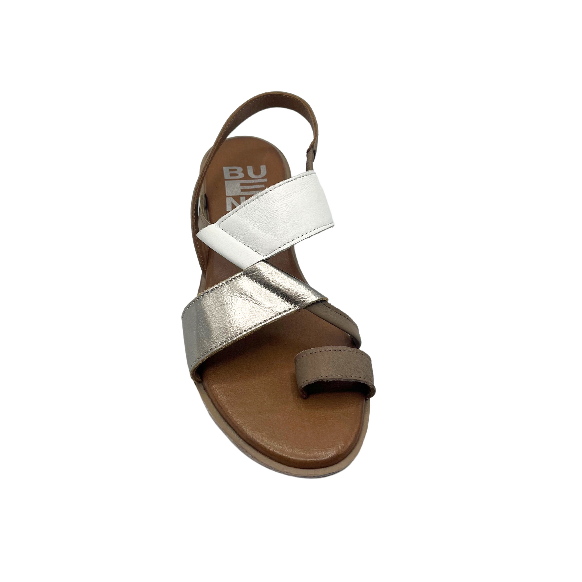 Top down view of a sandal in a combo of white, silver and brown leather.  Slip on style with elastic heel strap and toe loop