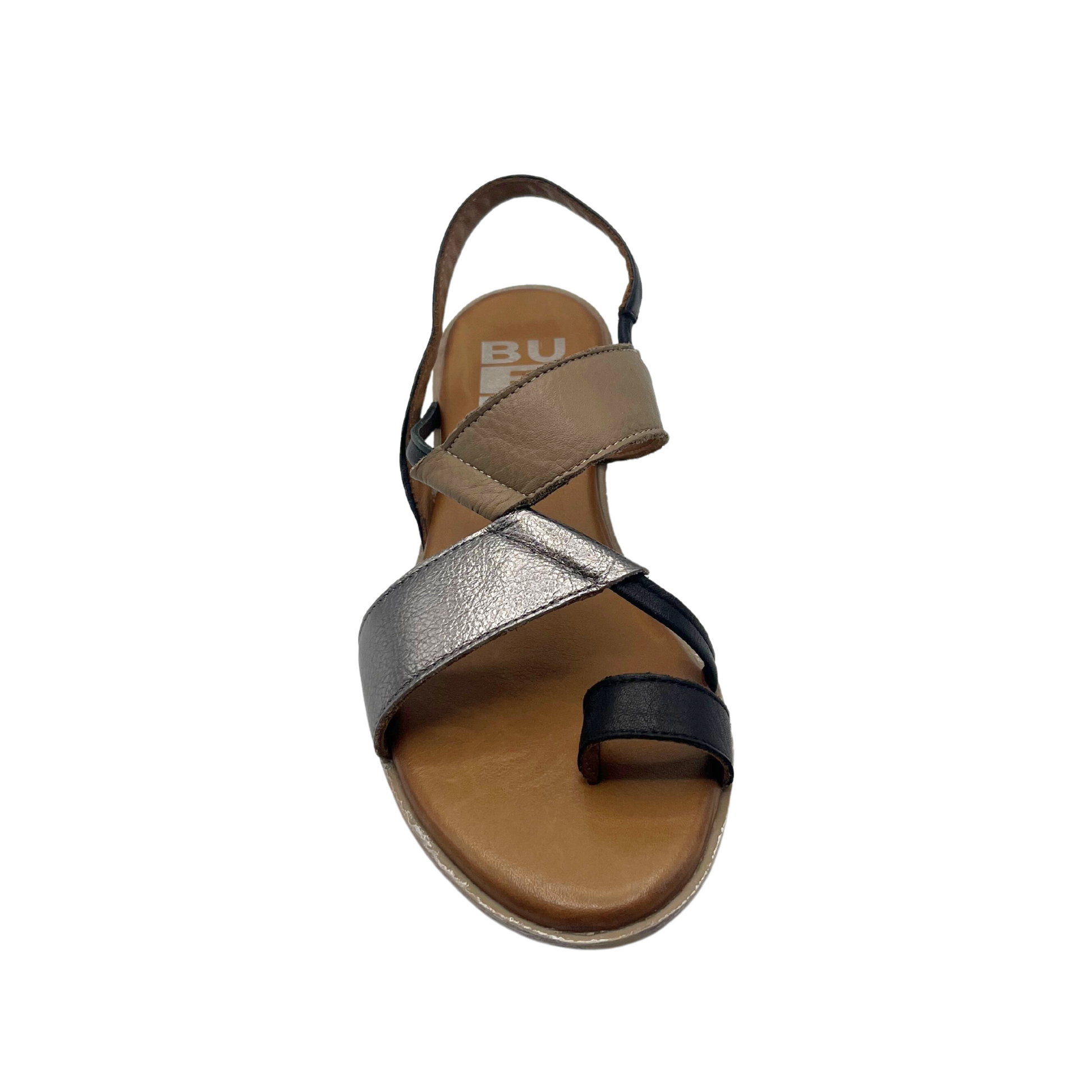 Top down view of a flat sandal with a toe loop and heel strap. Shown in a combo of black, silver and tan