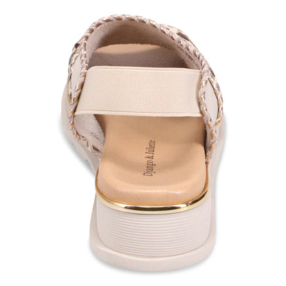 Beige Django & Juliette Carlenet sandal  with gold sole and braided details on a white background