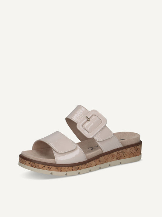 Beige sandal with cork sole on a white background