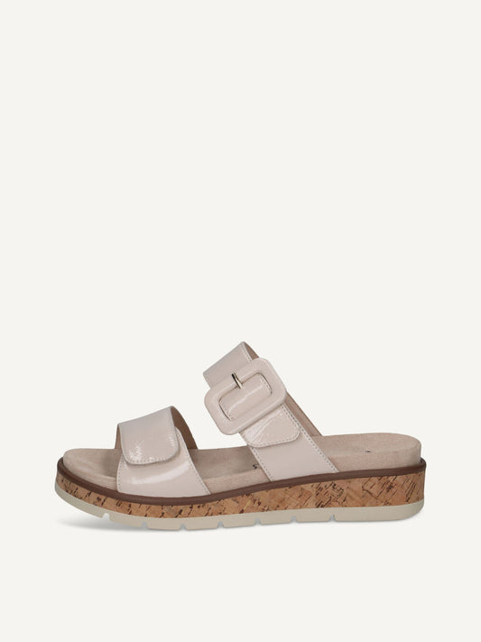 Beige sandal with cork sole on a white background