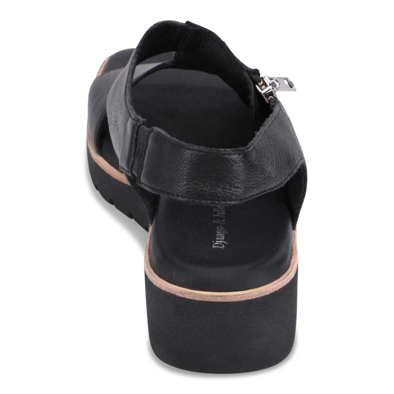 Black sandal with a platform sole on a white background