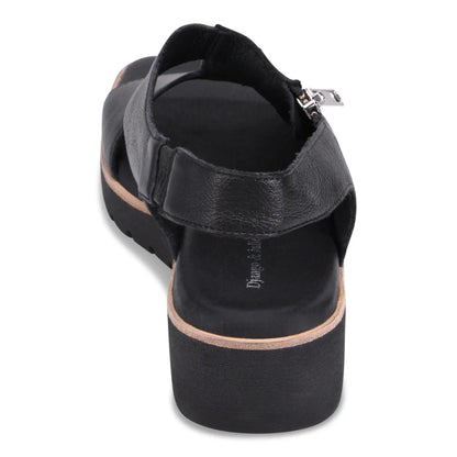Black sandal with a platform sole on a white background