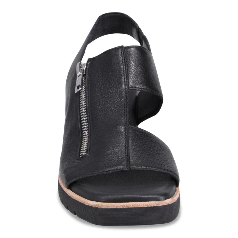 Black sandal with a small zipper on a white background
