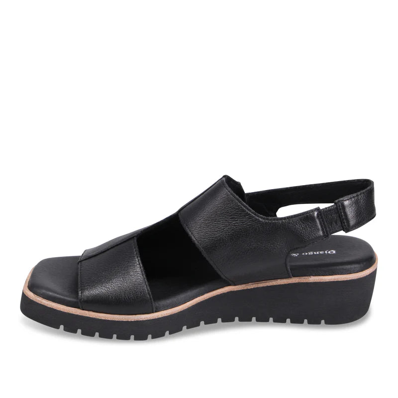 Black sandal with a platform sole on a white background
