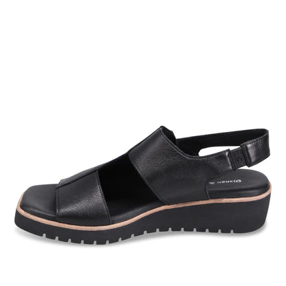 Black sandal with a platform sole on a white background