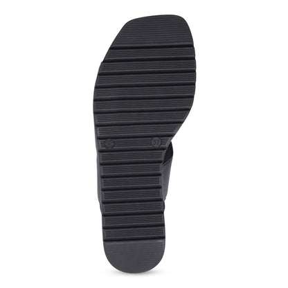 Black rubber sole of a shoe on a white background