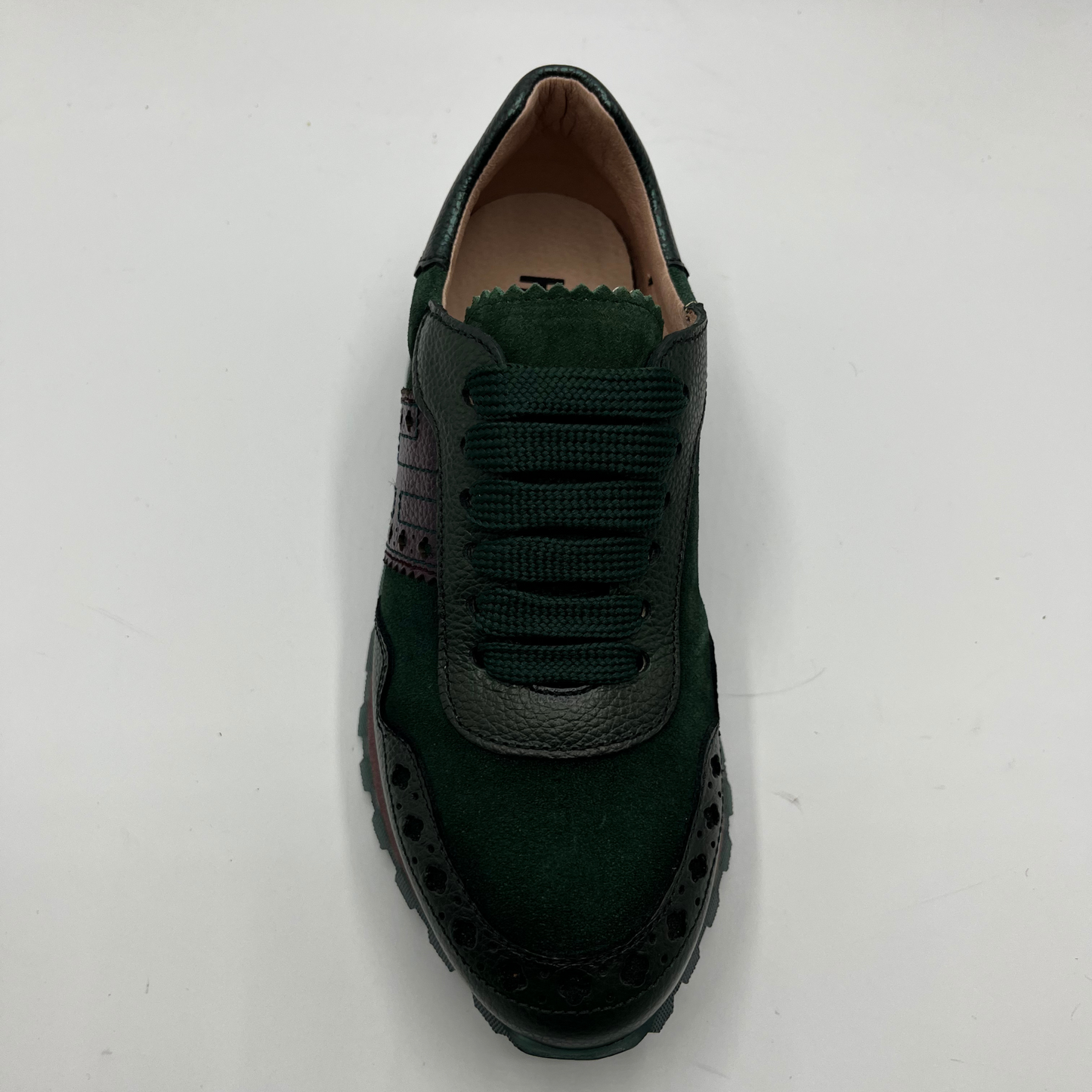 Green sneaker on a white background