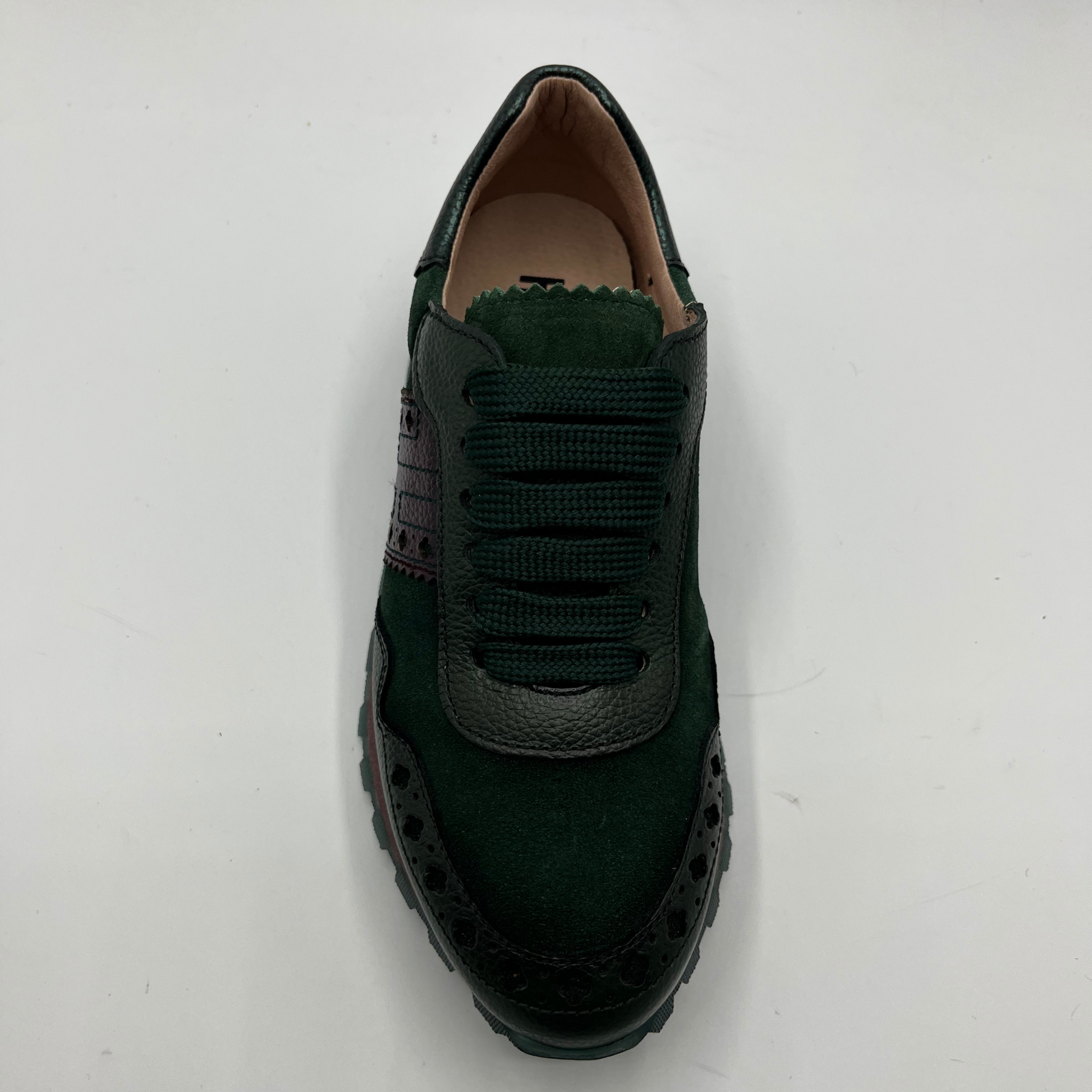 Green sneaker on a white background