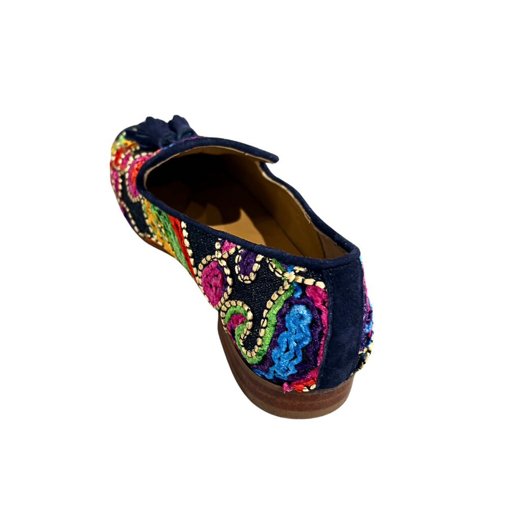Navy blue shoe with colorful embroidery on a white background
