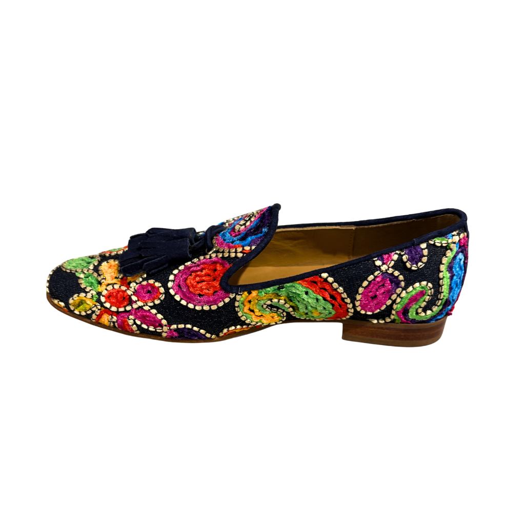 Colorful embroidered loafer on a white background